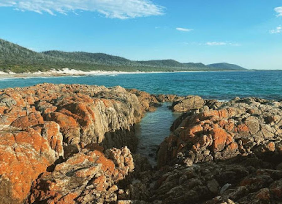 Explore the untouched beauty of Friendly Beaches, Tasmania's serene coastal paradise with pristine sands and stunning landscapes perfect for relaxation and adventure.