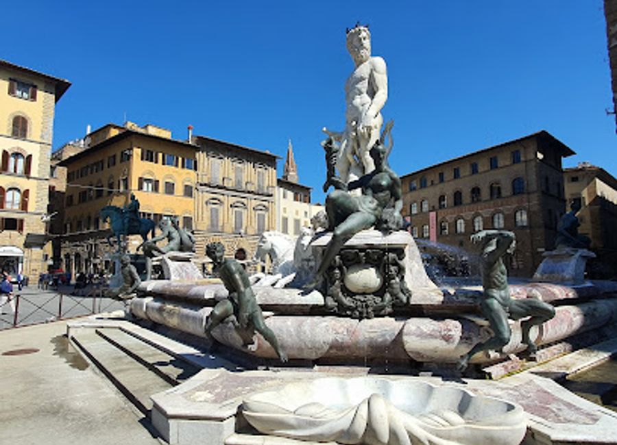 Discover the majestic Fountain of Neptune in Florence's Piazza della Signoria, a stunning Renaissance masterpiece and symbol of the city's artistic heritage.