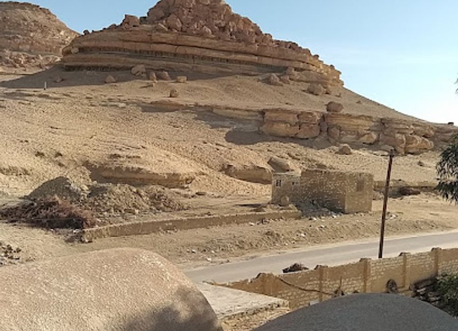 Hike Gabal Dakrur for breathtaking panoramic views of Siwa Oasis, ancient history, and a taste of local culture.