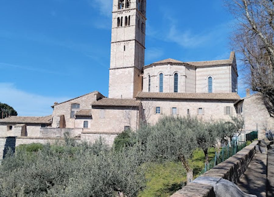 Explore the serene beauty of Basilica di Santa Chiara in Assisi, a must-visit spiritual landmark adorned with exquisite frescoes and rich history.