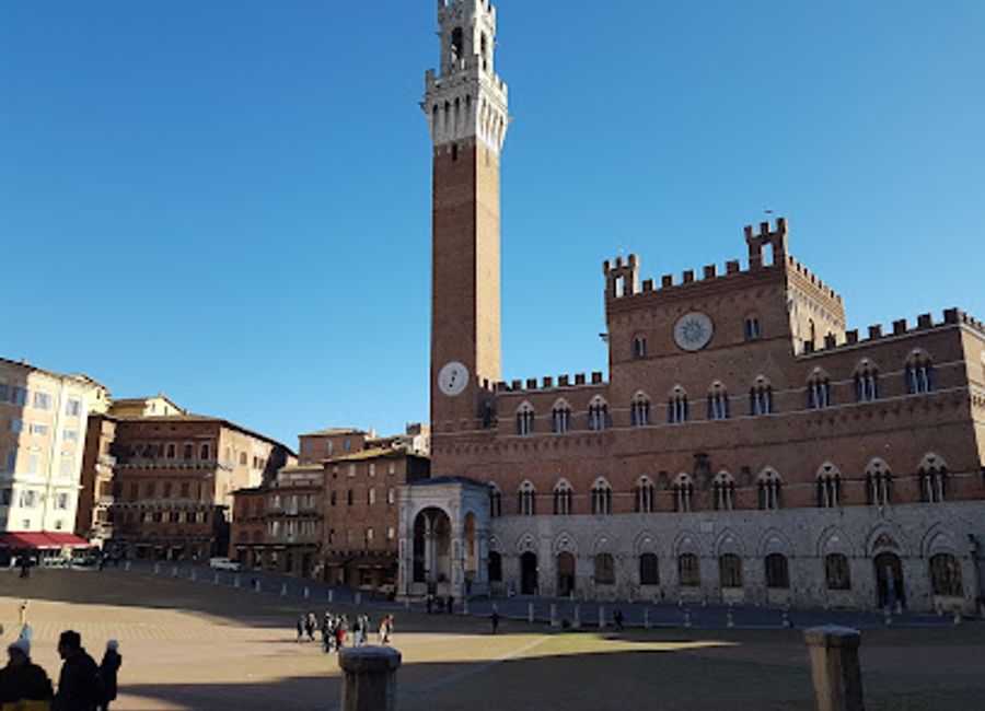 Discover the enchanting Porta Camollia, a medieval gateway in Siena, Italy, where history and culture blend seamlessly into a vibrant travel experience.