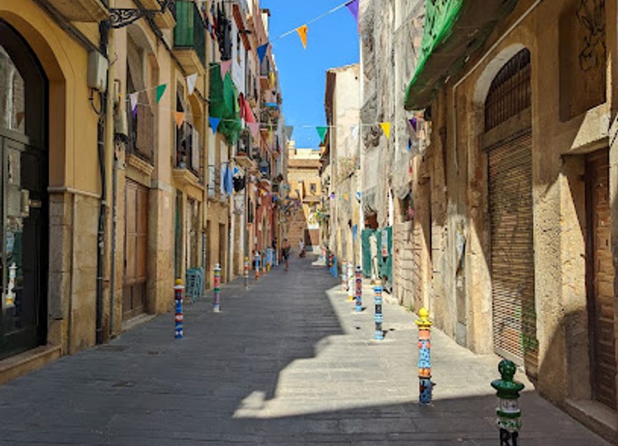 Explore the vibrant Pilons Street in Tarragona, where history, culture, and local flavors come together in a charming urban landscape.