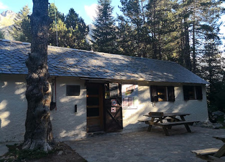 Experience the beauty of the Pyrenees at Refugi Ernest Mallafrè, a cozy mountain cabin perfect for outdoor adventures and peaceful retreats.