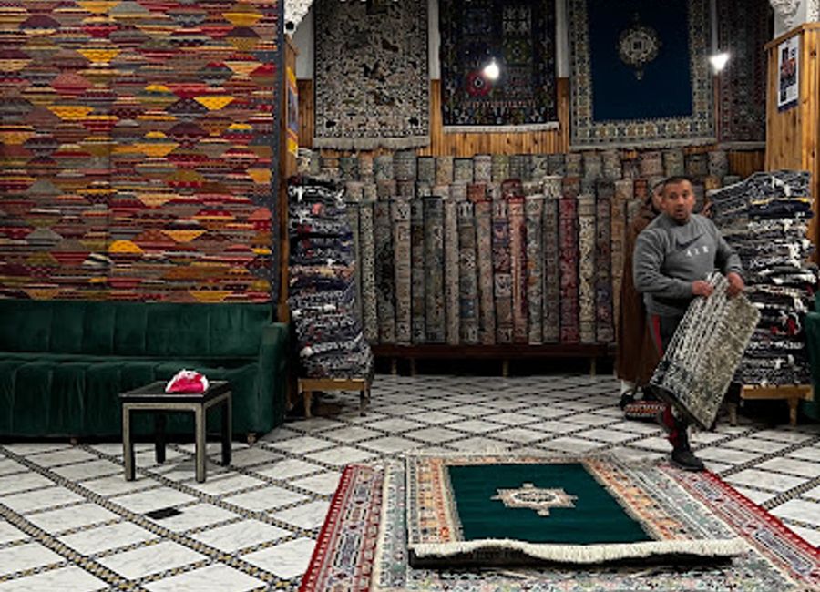 Explore the exquisite craftsmanship of handwoven carpets at Palais du Tresor in Fes, a true reflection of Moroccan artistry and tradition.