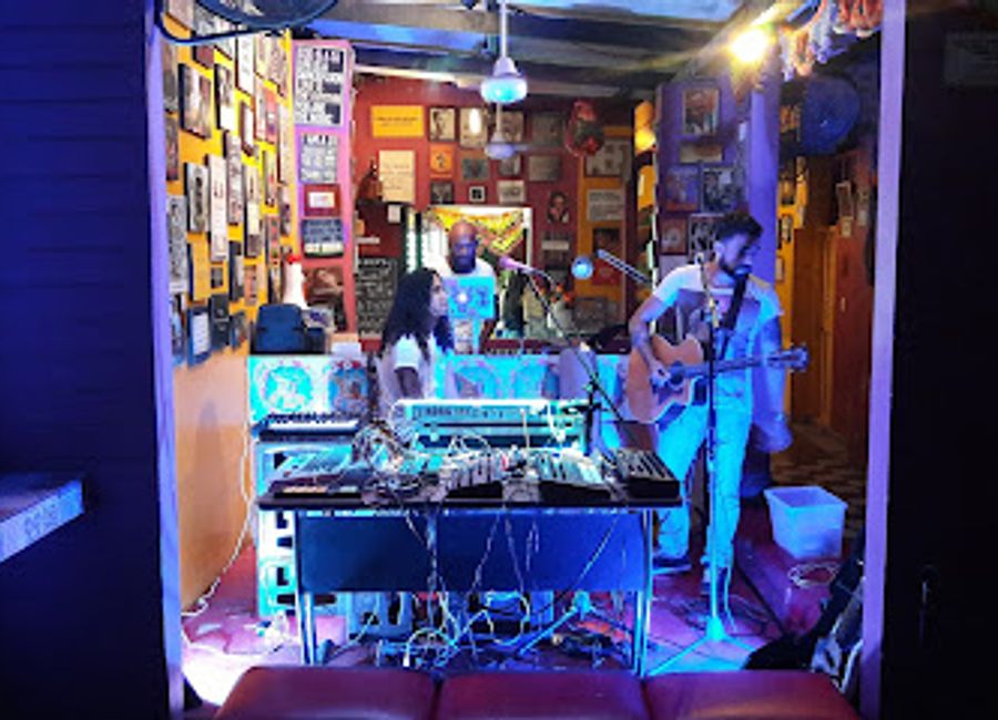 Discover the vibrant nightlife at La Puerta, a lively bar in Santa Marta offering an unforgettable atmosphere with great drinks and music.