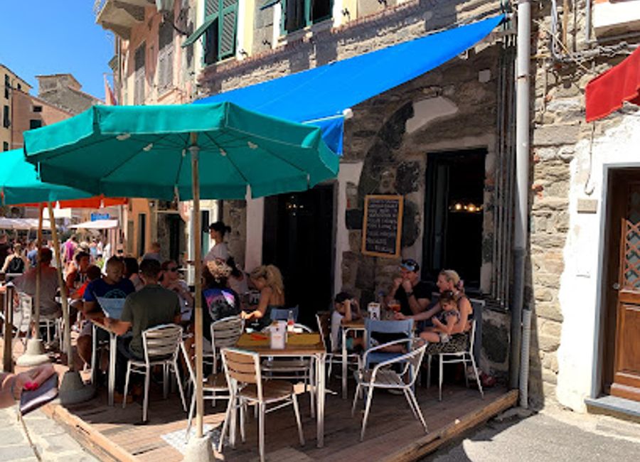 Discover the vibrant Blue Marlin Bar in Vernazza, where nightlife meets delicious Italian cuisine, creating an unforgettable experience by the sea.