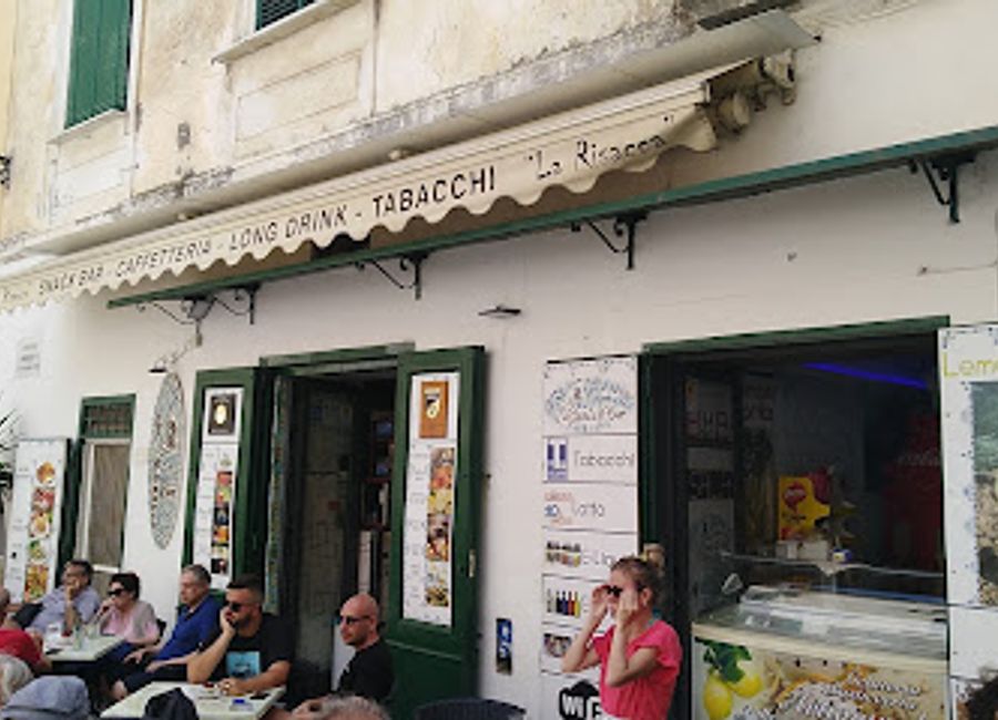 Sip exquisite wines and cocktails at Wine Bar La Risacca, a charming haven in Atrani's Piazza Umberto I, perfect for unwinding and savoring local flavors.