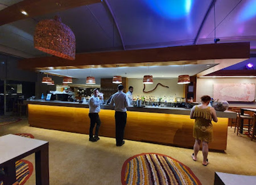 Discover the Walpa Lobby Bar: A charming oasis in the heart of the Outback, serving delightful drinks and local flavors in a cozy atmosphere.