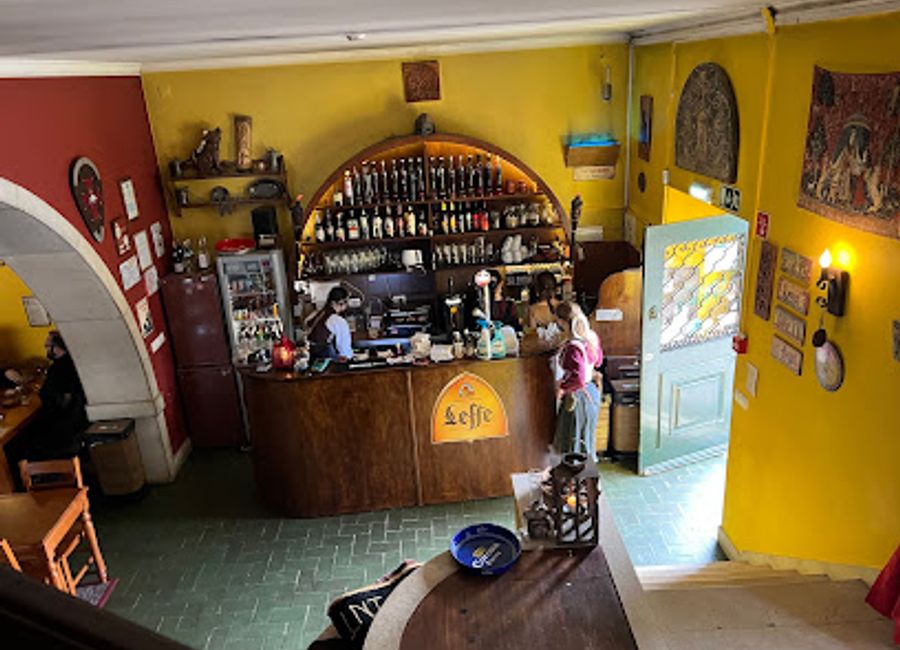 Experience the charm of Casa do Fauno in Sintra, where delightful drinks and a cozy bookstore create the perfect retreat for literary lovers and social butterflies alike.