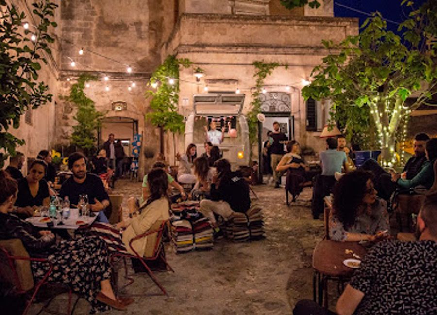 Experience the vibrant nightlife of Matera at AREA 8, a cocktail bar and event venue offering delicious drinks and lively entertainment.