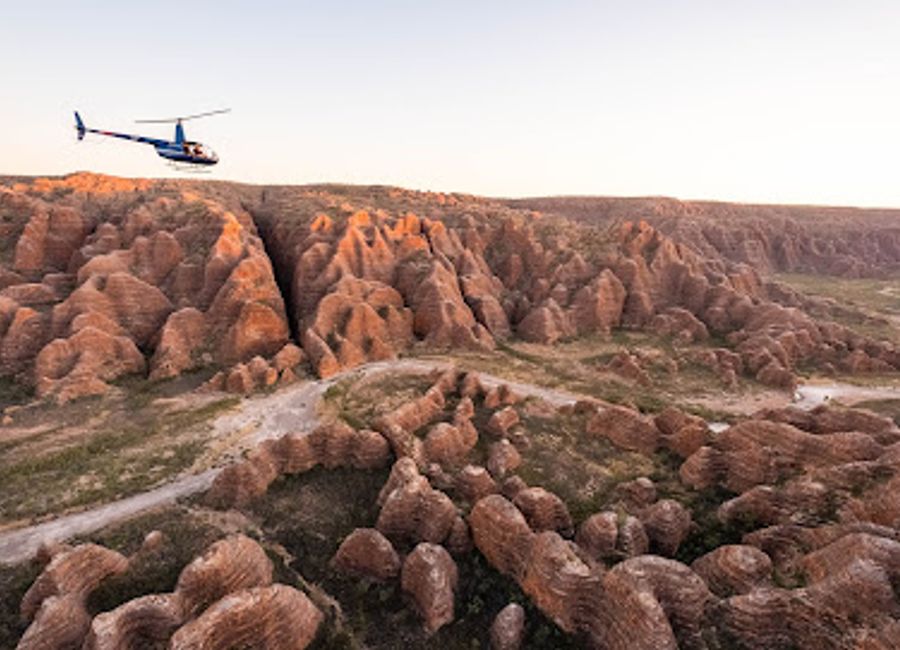 Discover the breathtaking aerial views of the Bungle Bungles with HeliSpirit's scenic helicopter tours in Purnululu National Park, Western Australia.