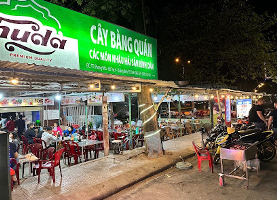 Discover the beauty of Phong Nha-Kẻ Bàng at Cây Bàng Quán, a scenic beer garden offering local brews and delicious cuisine amidst stunning nature.