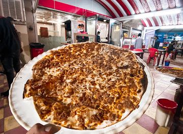 iraq/najaf/restaurant/neneo-restaurant-kibbeh-pizza-meat-dough