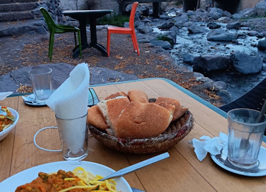 Experience authentic Moroccan cuisine with breathtaking mountain views at Restaurant Terrase d'Imlil in Irehhalen.