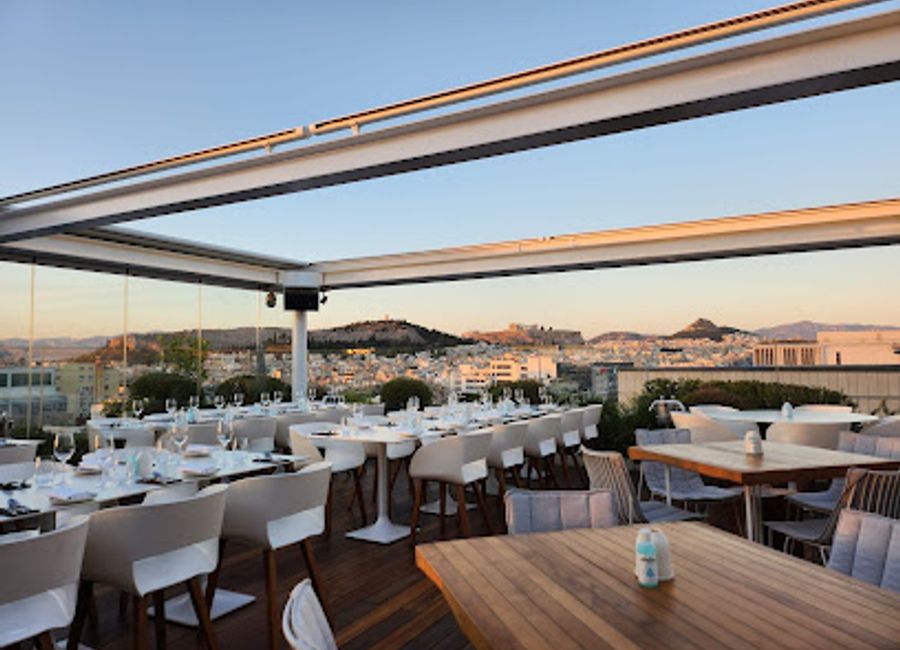 Experience innovative Greek cuisine with stunning views at Hytra Restaurant & Bar in Athens.