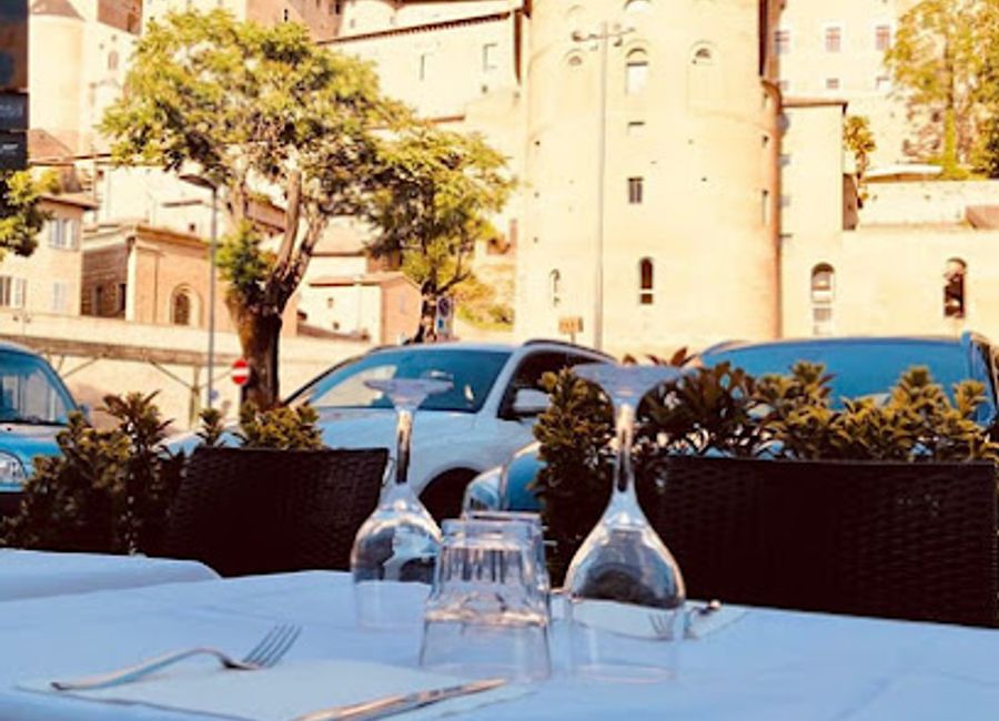 Experience authentic Italian cuisine at La Terrazza del Duca Urbino - where delicious pizzas meet fresh seafood amidst stunning views.