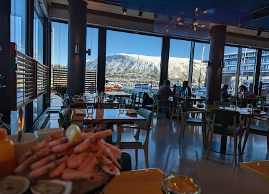 Experience the finest seafood dining at Fiskekompaniet in Tromsø—where fresh ingredients meet exquisite culinary artistry.