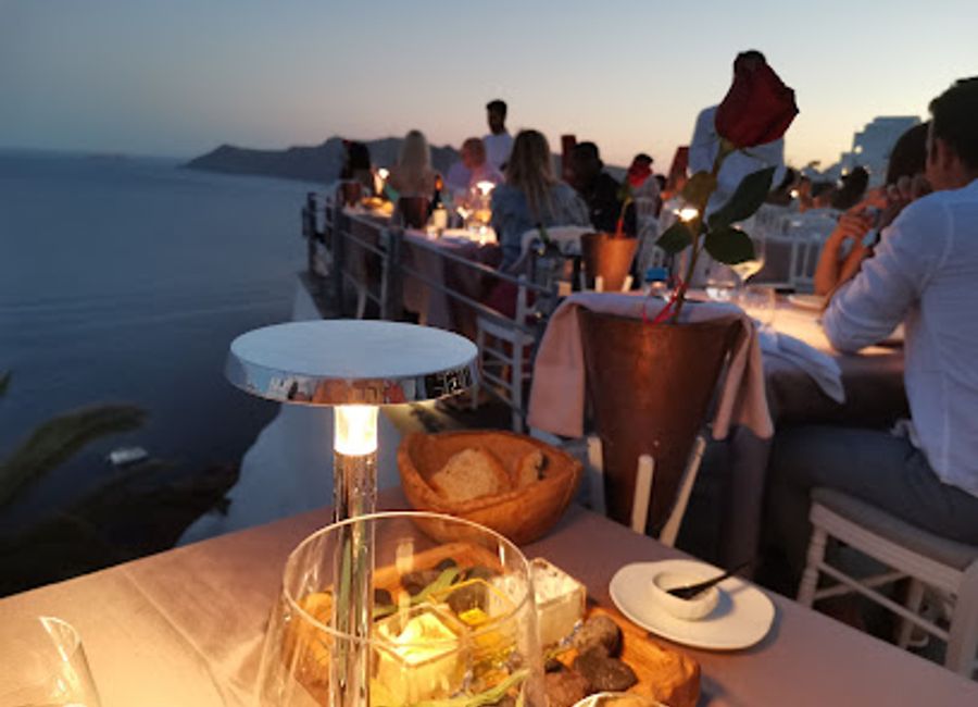 Experience exquisite Mediterranean flavors and breathtaking caldera views at Lauda Restaurant in Oia.