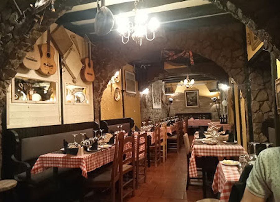 Discover authentic Portuguese flavors at Taverna dos Trovadores in Sintra - where every meal tells a story.