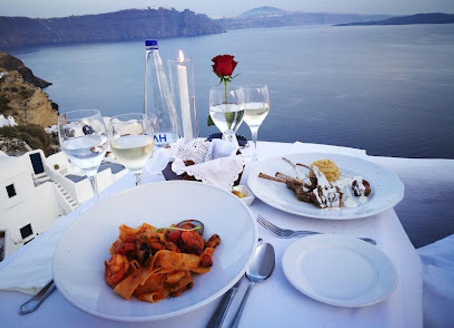 Experience authentic Greek cuisine at Ambrosia Restaurant with breathtaking views over the Aegean Sea in Oia.