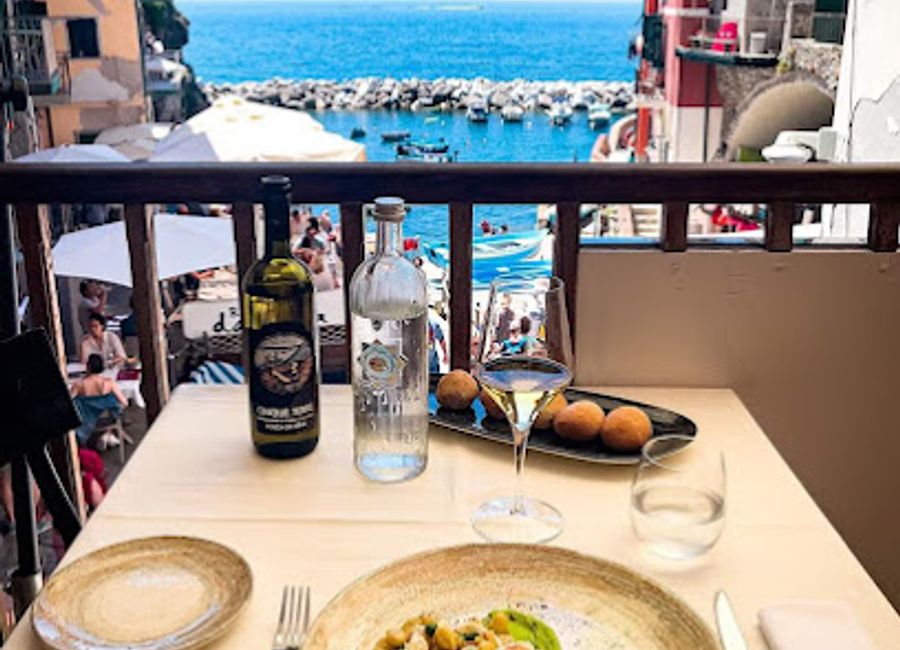 Experience authentic Italian cuisine with stunning views at Rio Bistrot in picturesque Riomaggiore.