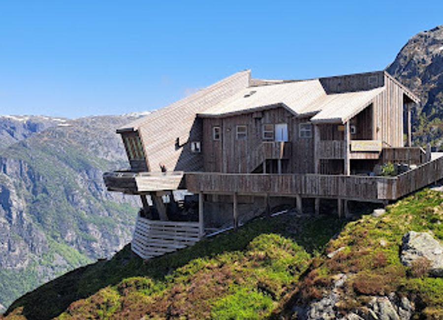 Experience exquisite Norwegian cuisine amidst stunning fjord views at Kjerag (Øygardstøl), a must-visit culinary destination.