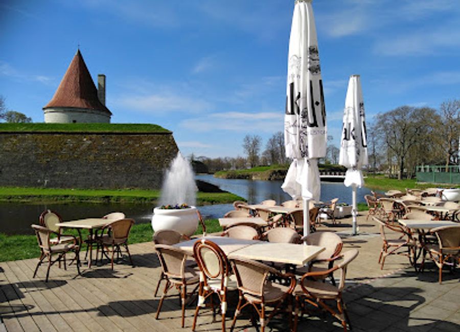 Experience exquisite seafood at Ku-Kuu Fish Restaurant and Guesthouse while enjoying breathtaking views of Kuressaare Castle.