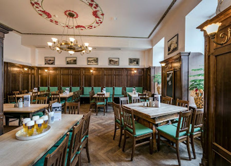 Indulge in authentic Austrian cuisine and refreshing local brews at Goldene Kugel, Salzburg's beloved restaurant and beer hall.