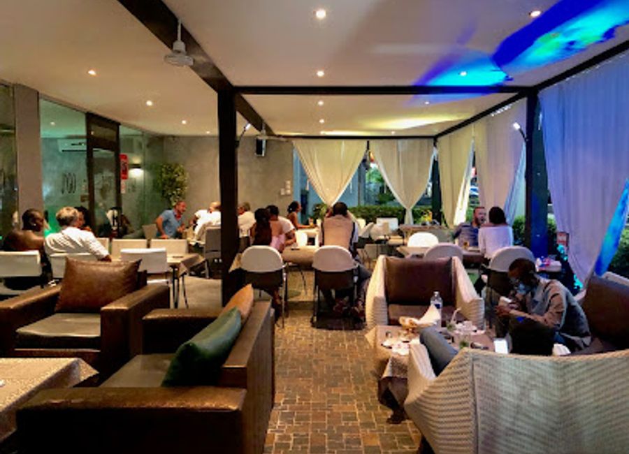 Experience the vibrant flavors of Senegal at Restaurant J’Go in Dakar - where culinary tradition meets modern lounge ambiance.