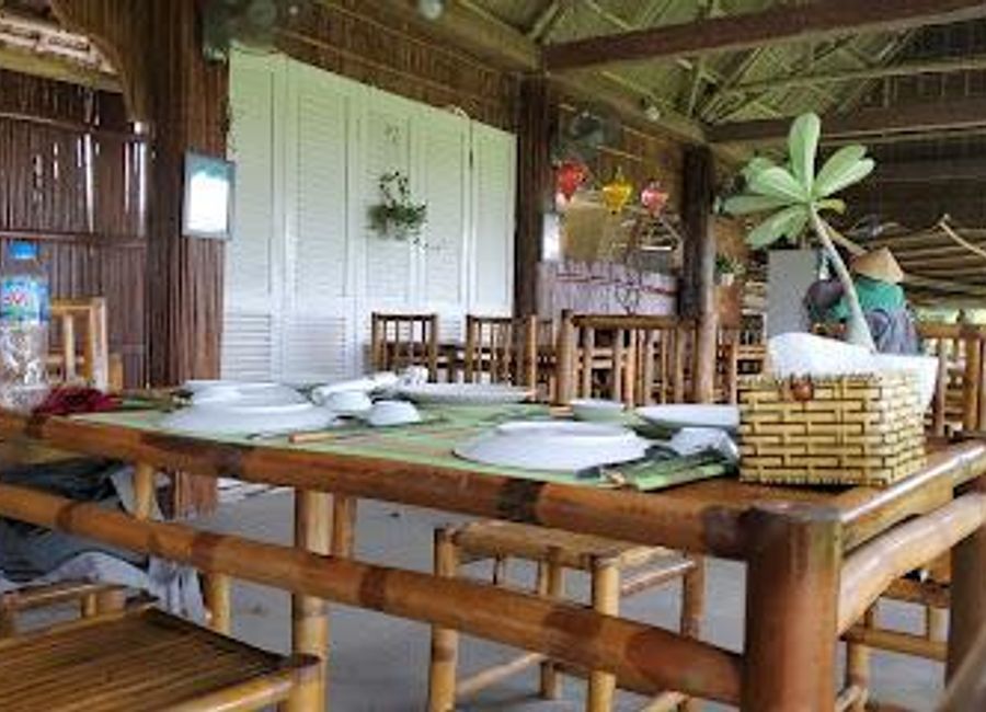 Discover authentic Vietnamese cuisine and hands-on cooking experiences at Tra Que Water Wheel Restaurant in Hội An.