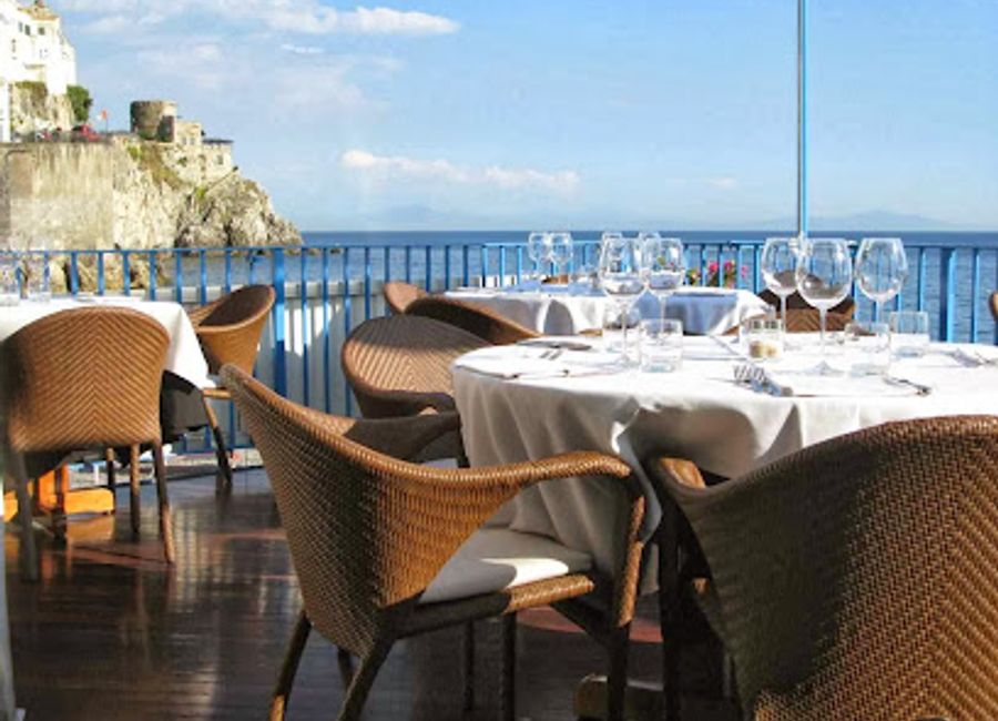 Experience authentic Southern Italian cuisine with stunning coastal views at Marina Grande in Amalfi.