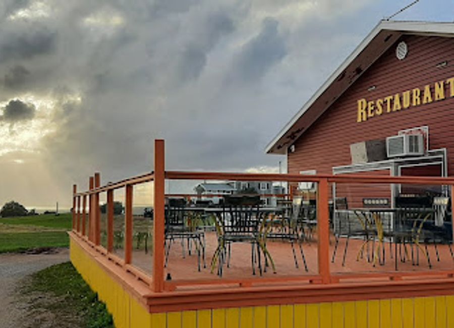 Experience authentic Nova Scotian cuisine with breathtaking views at Belle View Restaurant Ltd along the iconic Cabot Trail.