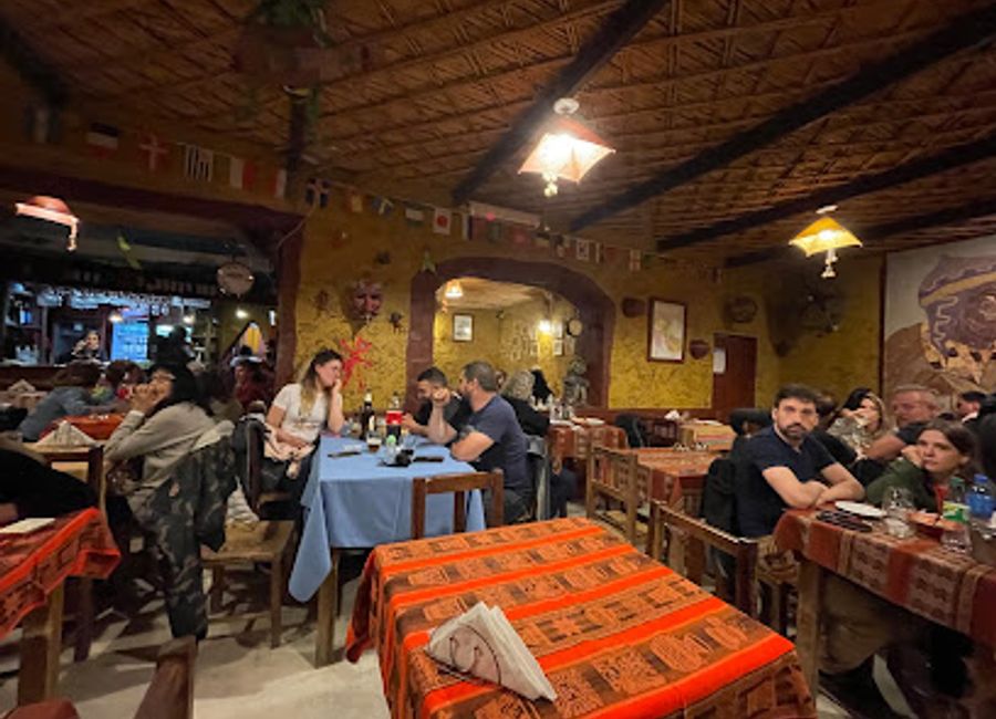 Experience authentic Argentine cuisine and vibrant cultural performances at La Peña de Rolito in Tilcara.