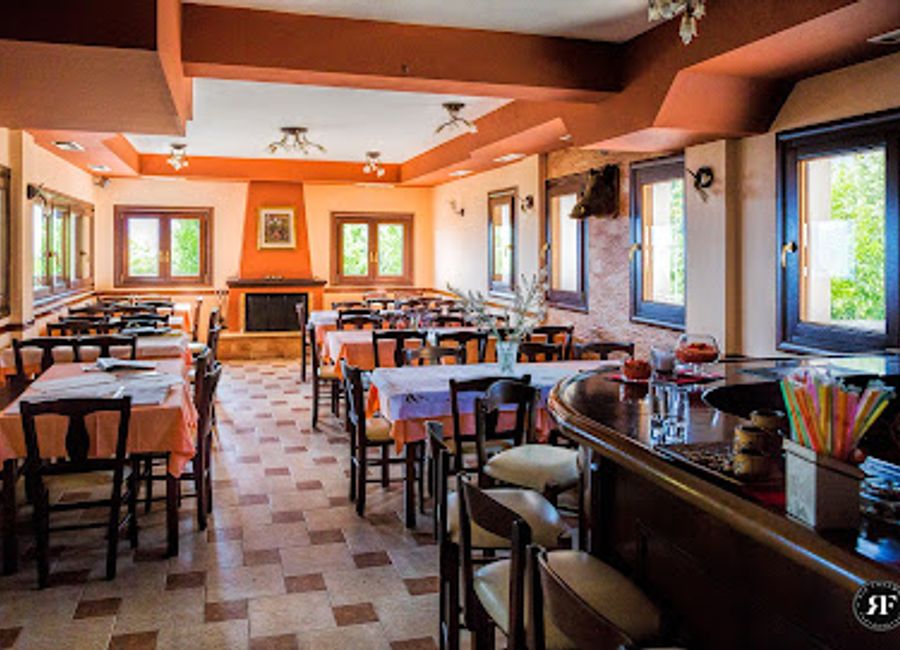 Discover Eagle Nest Restaurant in Vlachava - where delicious Greek cuisine meets stunning views in a warm and inviting atmosphere.