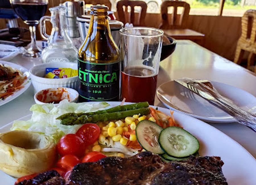 Savor the essence of Chilean cuisine at Rio Grande Restaurant in Futaleufú - where local flavors meet stunning views.