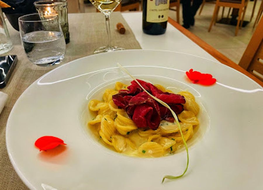 Experience authentic Italian cuisine at Ristorante Adige in Trento, where local flavors meet exceptional dining in a warm atmosphere.
