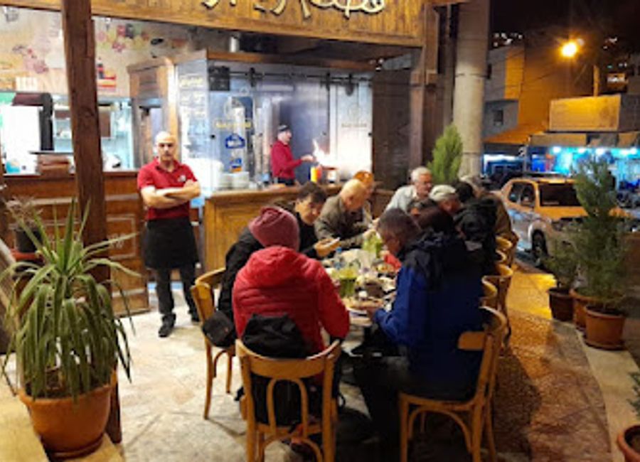 Experience authentic Jordanian cuisine alongside fast food favorites at Rainbow Restaurant in Wadi Musa - perfect for every traveler.