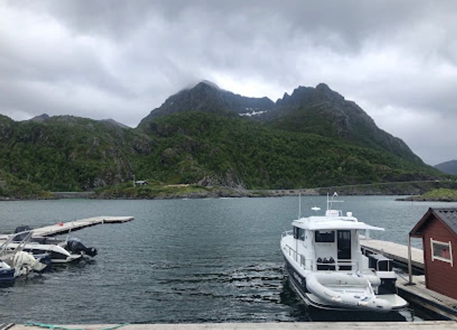 Experience local Norwegian cuisine with stunning fjord views at Storbrygga Spiseri in Skaland.