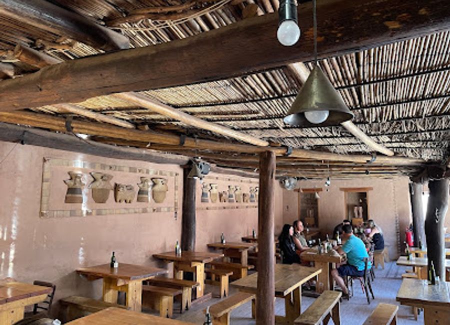 Experience authentic Chilean cuisine at Adobe in San Pedro de Atacama, where tradition meets flavor in an inviting atmosphere.