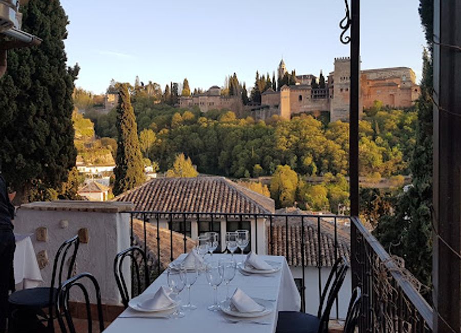 Experience authentic Mediterranean cuisine amidst stunning views at Restaurante Mirador de Morayma in Granada's historic Albaicín district.