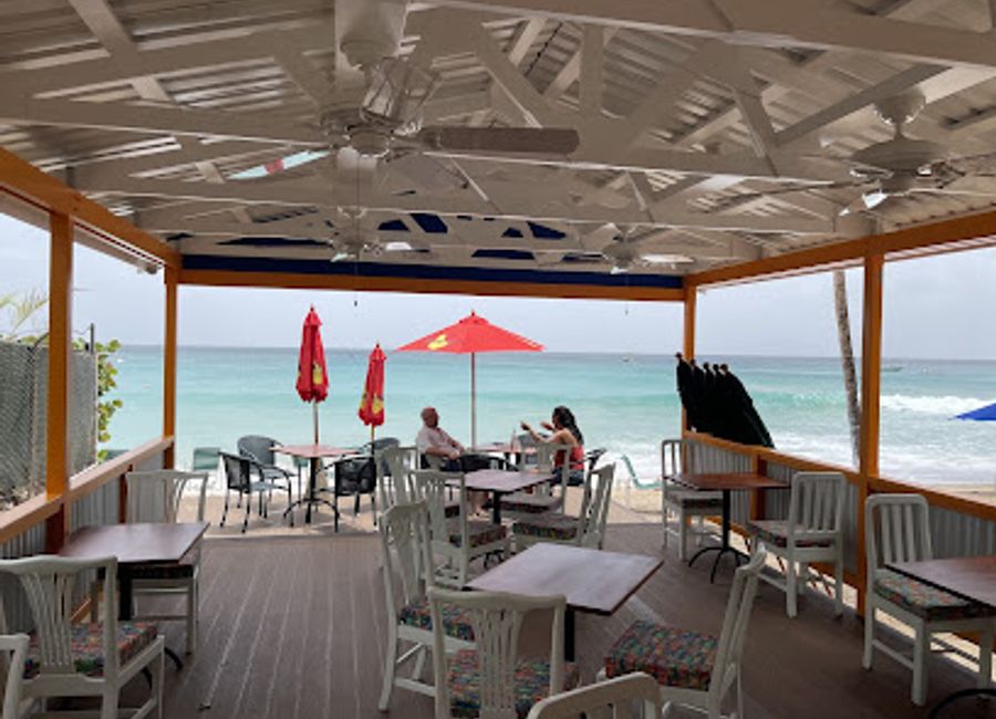 Discover fresh seafood and stunning ocean views at JuJu's Beach Bar in Mount Standfast, Barbados - A perfect blend of taste and tranquility.