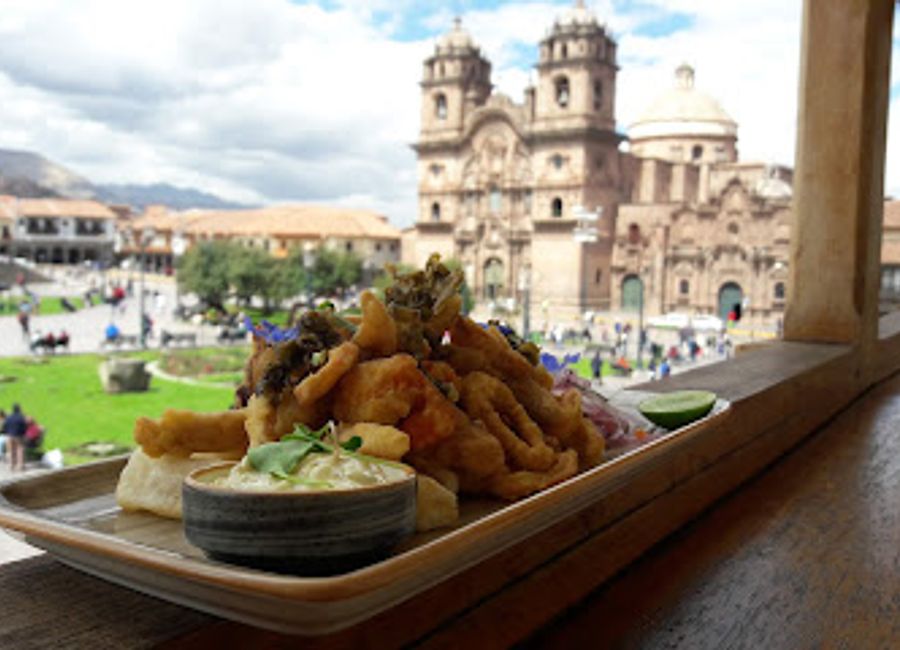 Experience authentic Peruvian flavors at Calle del Medio Restaurante Bar in Cusco's vibrant Plaza de Armas.