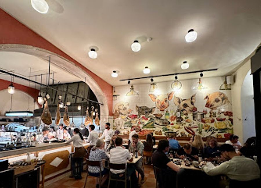 Experience the vibrant culinary delights at Pateo - Bairro do Avillez in Lisbon, where tradition meets modernity in every dish.