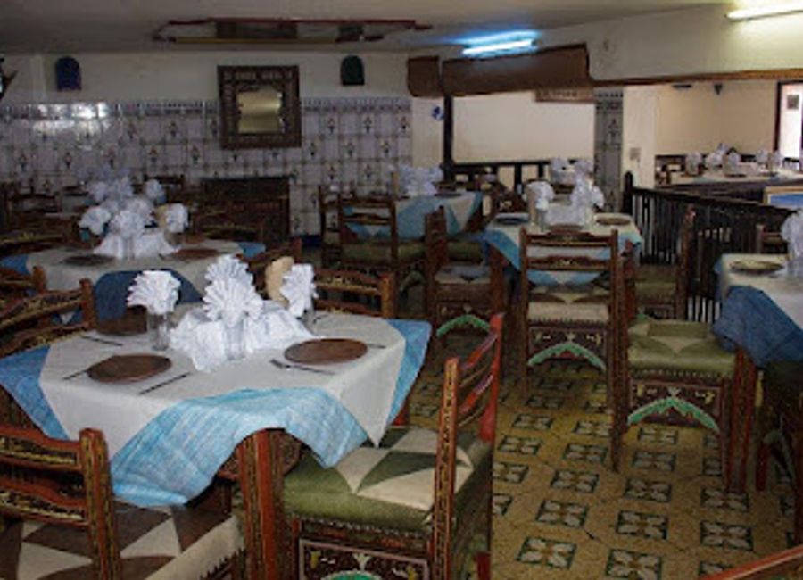 Experience the authentic flavors of Morocco at Bar Oum Rabie, where delicious grilled dishes meet fine wines in Chefchaouen's stunning backdrop.