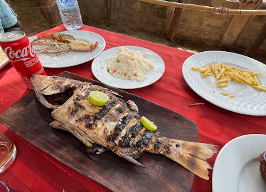 Experience fresh seafood with stunning ocean views at Café de la Plage - Chez Platini in beautiful Cap Skirring.