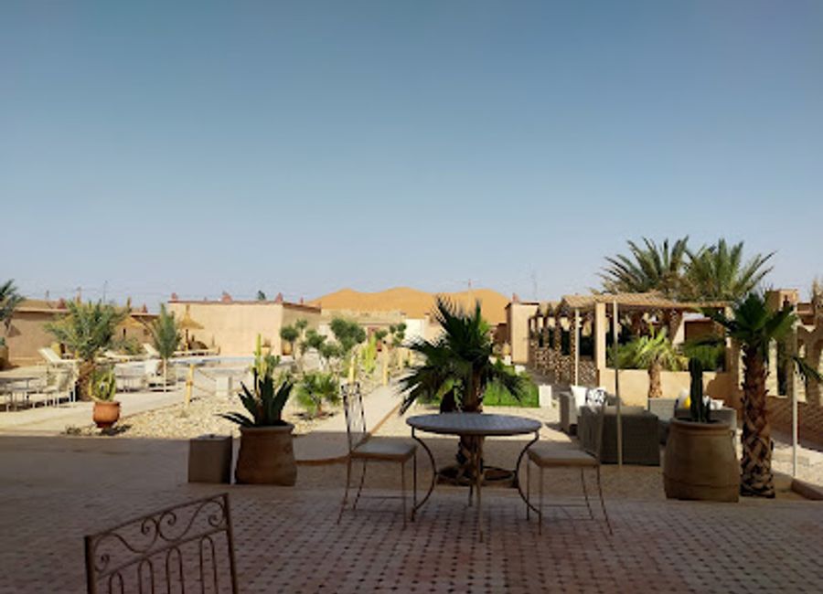 Experience authentic Moroccan flavors at Café Restaurant Rimal Merzouga—where culinary delights meet breathtaking desert views.