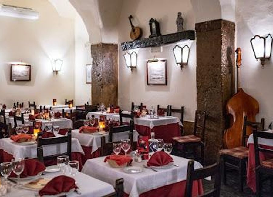 Discover Lisbon's rich musical heritage at Clube de Fado - where authentic Portuguese cuisine meets soulful live performances.