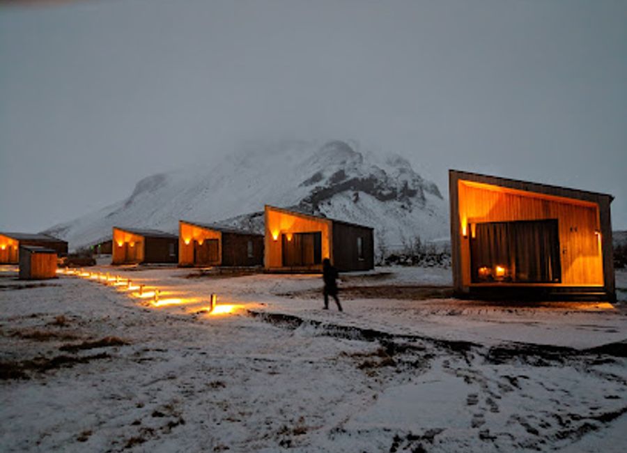 Experience Icelandic flavors at Arnarstapi Center's Snjófell Restaurant amidst breathtaking coastal views.
