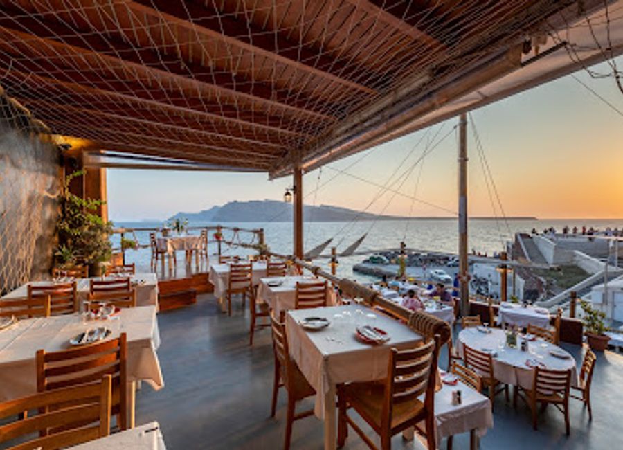 Discover fresh seafood delights with breathtaking views at Ammoudi Fish Tavern in Santorini's picturesque Ammoudi Bay.