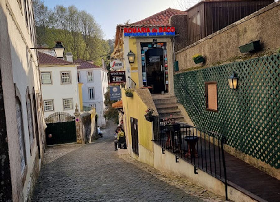 Discover authentic Portuguese cuisine at Romaria de Baco in Sintra's historic center; a culinary journey through traditional flavors awaits you.